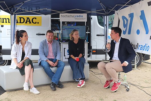 Panel zum Thema Sport und die Klimakrise mit Ute Groth, Jens Wortmann und Alice Berger, moderiert von Maximilian Rieger.