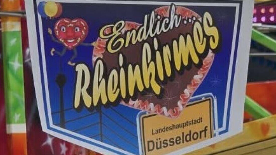 Man sieht ein Wimpel mit der Aufschrift "Endlich Rheinkirmes"